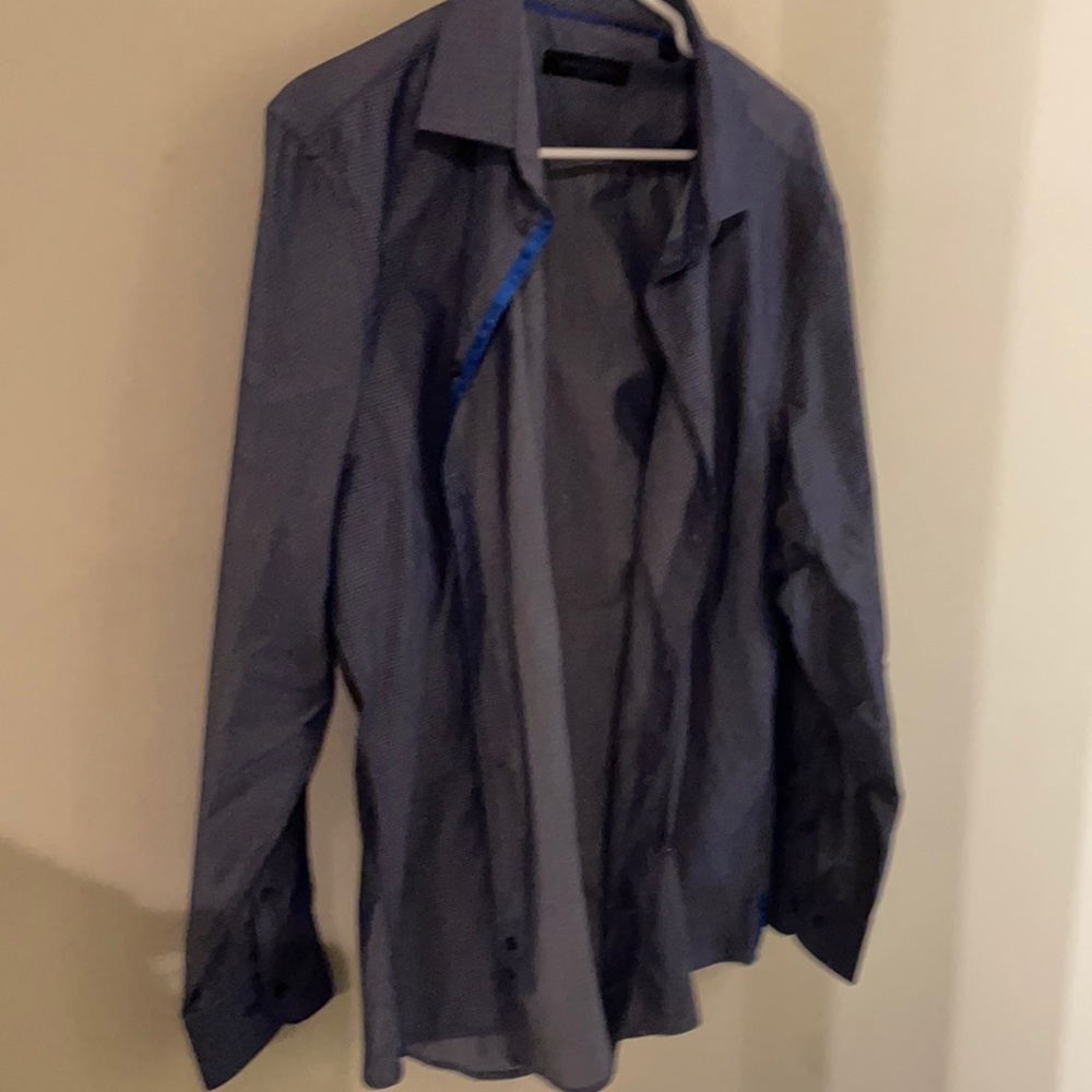 Barely worn dress shirt..sat in closet on a hanger just needs ironed.